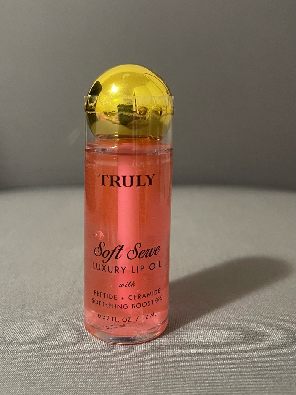TRULY Soft Serve Luxury Lip Oil — Coral Pink with Gold Cap